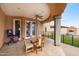 Spacious covered patio with tile floor, ceiling fan, and barbecue, perfect for outdoor dining and entertaining at 1031 W Cornell Dr, Tempe, AZ 85283