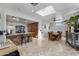 Bright dining room features a skylight, wood table with seating for eight, and a stone-accented island view at 1031 W Cornell Dr, Tempe, AZ 85283