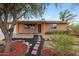 Inviting single-story home with xeriscape yard, solar panels, and charming curb appeal at 1031 W Cornell Dr, Tempe, AZ 85283