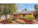 Charming home featuring solar panels, a well-maintained yard, and unique landscaping at 1031 W Cornell Dr, Tempe, AZ 85283