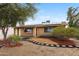 Inviting single-story home with xeriscape yard, solar panels, and charming curb appeal at 1031 W Cornell Dr, Tempe, AZ 85283