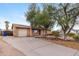 Charming single-story home featuring a landscaped front yard and an attached one-car garage at 1031 W Cornell Dr, Tempe, AZ 85283