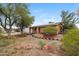 Inviting single-story home with solar panels and low-maintenance landscaping featuring a brick walkway at 1031 W Cornell Dr, Tempe, AZ 85283