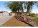 Charming single-story home featuring a xeriscaped front yard with decorative rocks and desert plants at 1031 W Cornell Dr, Tempe, AZ 85283