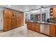 Updated kitchen with stainless steel appliances, generous storage, and granite counters, flowing into the dining area at 1031 W Cornell Dr, Tempe, AZ 85283