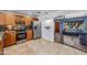 Bright kitchen featuring stainless steel appliances, wood cabinets, and an arched entryway to the living room at 1031 W Cornell Dr, Tempe, AZ 85283