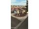 Single-story home with tile roof, two car garage, brown gravel, and rock front yard at 10463 W Medlock Dr, Glendale, AZ 85307