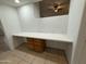 A bright office with a built-in desk and cabinets to maximize space and storage at 10463 W Medlock Dr, Glendale, AZ 85307