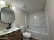 Well-lit bathroom featuring modern fixtures, vanity, toilet, and shower tub combo at 1051 S Dobson Rd # 44, Mesa, AZ 85202