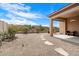 Spacious backyard with desert landscaping and mountain views, includes a covered patio at 10613 E Blanche Dr, Scottsdale, AZ 85255