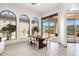 Bright dining room with plenty of natural light, tile flooring, and sliding glass doors for indoor/outdoor living at 10613 E Blanche Dr, Scottsdale, AZ 85255