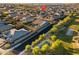 Aerial view showcasing a home with a private pool, landscaped backyard, and community playground at 12531 W Tuckey Ln, Glendale, AZ 85307