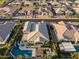 Beautiful home with pool, spa, and manicured backyard, seen from an aerial view at 12531 W Tuckey Ln, Glendale, AZ 85307