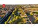 Wide aerial view showcasing community playground and green space with nearby homes and walking paths at 12531 W Tuckey Ln, Glendale, AZ 85307