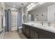 Stylish bathroom features a decorative shower curtain and nautical accents at 12531 W Tuckey Ln, Glendale, AZ 85307