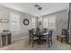 Bright dining area features wood floors, plantation shutters, and modern lighting fixtures at 12531 W Tuckey Ln, Glendale, AZ 85307