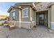 Inviting front porch with decorative stone accents and rocking chairs at 12531 W Tuckey Ln, Glendale, AZ 85307