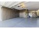 Spacious garage with ample cabinet storage and epoxy flooring, providing organization and style at 12531 W Tuckey Ln, Glendale, AZ 85307