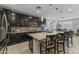 Modern kitchen boasts granite counters, stainless appliances, pendant lighting, and an open layout at 12531 W Tuckey Ln, Glendale, AZ 85307