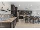 Stunning kitchen featuring granite countertops, stainless steel appliances and custom backsplash at 12531 W Tuckey Ln, Glendale, AZ 85307