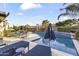 Inviting pool area with lounge chairs, poolside bar, and meticulous landscaping, perfect for outdoor entertaining at 12531 W Tuckey Ln, Glendale, AZ 85307