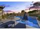 Inviting pool area with lounge chairs, poolside bar, and meticulous landscaping, perfect for outdoor entertaining at 12531 W Tuckey Ln, Glendale, AZ 85307