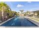 Backyard pool features lush landscaping, water features, patio and ample seating at 12531 W Tuckey Ln, Glendale, AZ 85307