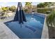 Inviting pool area with lounge chairs, poolside bar, and meticulous landscaping, perfect for outdoor entertaining at 12531 W Tuckey Ln, Glendale, AZ 85307