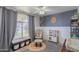 Cozy bedroom with playful decor and a window bench for reading or toy storage at 1550 E Park Ave, Gilbert, AZ 85234