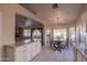 Sunlit dining area with circular table and backyard views off the open concept kitchen at 1550 E Park Ave, Gilbert, AZ 85234