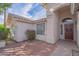 Inviting entryway with brick pathway leading to a charming home featuring a well-kept exterior at 1550 E Park Ave, Gilbert, AZ 85234