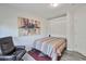 Cozy bedroom featuring new floors, a comfortable leather chair and modern design at 16131 W Indianola Ave, Goodyear, AZ 85395