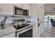 Well-equipped kitchen with stainless steel appliances, granite countertops, and ample storage at 16131 W Indianola Ave, Goodyear, AZ 85395