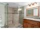 Bathroom featuring an updated shower with glass door, updated vanity and mirror at 16616 E Palisades Blvd # 109, Fountain Hills, AZ 85268