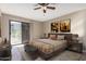 Comfortable bedroom with balcony access, furnished with a plush bed and contemporary decor for a relaxing retreat at 16616 E Palisades Blvd # 109, Fountain Hills, AZ 85268