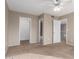 Bedroom featuring neutral walls, sliding door to balcony, ceiling fan and carpet at 16616 E Palisades Blvd # 109, Fountain Hills, AZ 85268