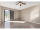 Bedroom with a sliding glass door and wood-look floors at 16616 E Palisades Blvd # 109, Fountain Hills, AZ 85268