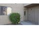 Charming home with well-maintained front yard landscaping featuring a flowering shrub and a light-colored stucco facade at 16616 E Palisades Blvd # 109, Fountain Hills, AZ 85268