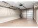 Spacious garage featuring epoxy flooring, overhead storage racks, and an insulated garage door at 16616 E Palisades Blvd # 109, Fountain Hills, AZ 85268
