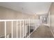 Hallway featuring an open railing to the stairwell, neutral walls and carpet at 16616 E Palisades Blvd # 109, Fountain Hills, AZ 85268