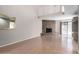 Spacious living room featuring a fireplace, loft, and sliding glass door at 16616 E Palisades Blvd # 109, Fountain Hills, AZ 85268