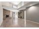 Bright, open living room with a fireplace, loft, and sliding glass door at 16616 E Palisades Blvd # 109, Fountain Hills, AZ 85268