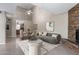 Bright living room featuring a stone fireplace, vaulted ceilings, and modern furnishings for a cozy yet elegant ambiance at 16616 E Palisades Blvd # 109, Fountain Hills, AZ 85268