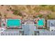 Aerial view of the swimming pool, outdoor seating, and golf course, surrounded by desert landscape at 17443 N Goldwater Dr, Surprise, AZ 85374