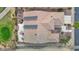 Bird's eye view of home's roof with solar panels, tiled patio, and lush backyard landscaping at 17443 N Goldwater Dr, Surprise, AZ 85374