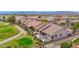 Property bordering golf course featuring solar panels, lush backyard, and covered patio at 17443 N Goldwater Dr, Surprise, AZ 85374