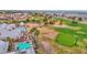 Aerial view of the clubhouse, swimming pool, and golf course showcasing lush desert landscape at 17443 N Goldwater Dr, Surprise, AZ 85374
