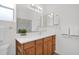 A well-lit bathroom with a large mirror, vanity, and ample storage at 17443 N Goldwater Dr, Surprise, AZ 85374