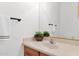 Cozy bathroom with wood vanity and a decorative flower at 17443 N Goldwater Dr, Surprise, AZ 85374