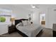 Cozy bedroom with plush carpeting, ceiling fan, and en-suite bathroom at 17443 N Goldwater Dr, Surprise, AZ 85374